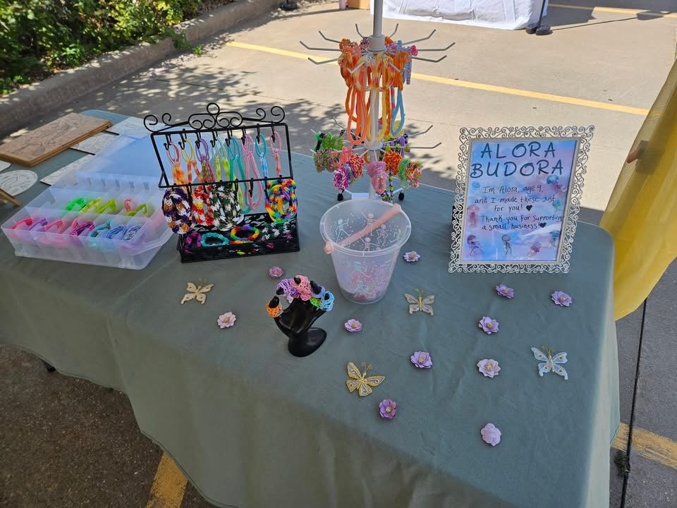 Alora Budora handmade bracelets, rings and colorful accessories displayed at market